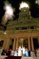 Olympic torch arrives in Sydney Town Hall amid fireworks display